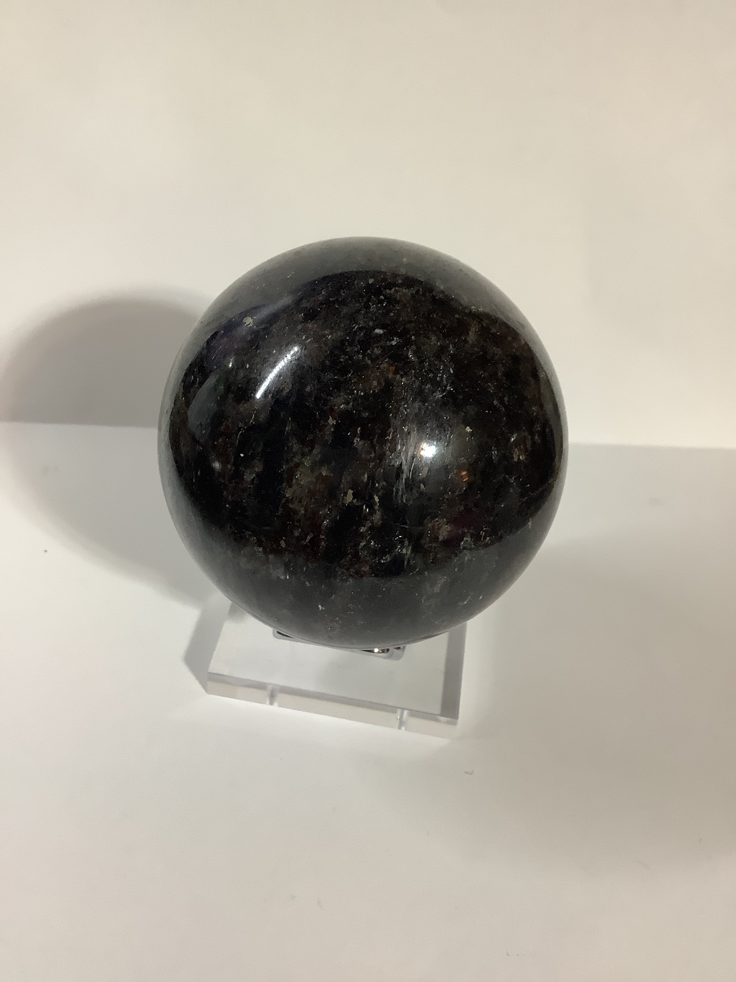 Astrophyllite and Garnet Sphere - Fireworks Stone with Blue and Silver Flashes