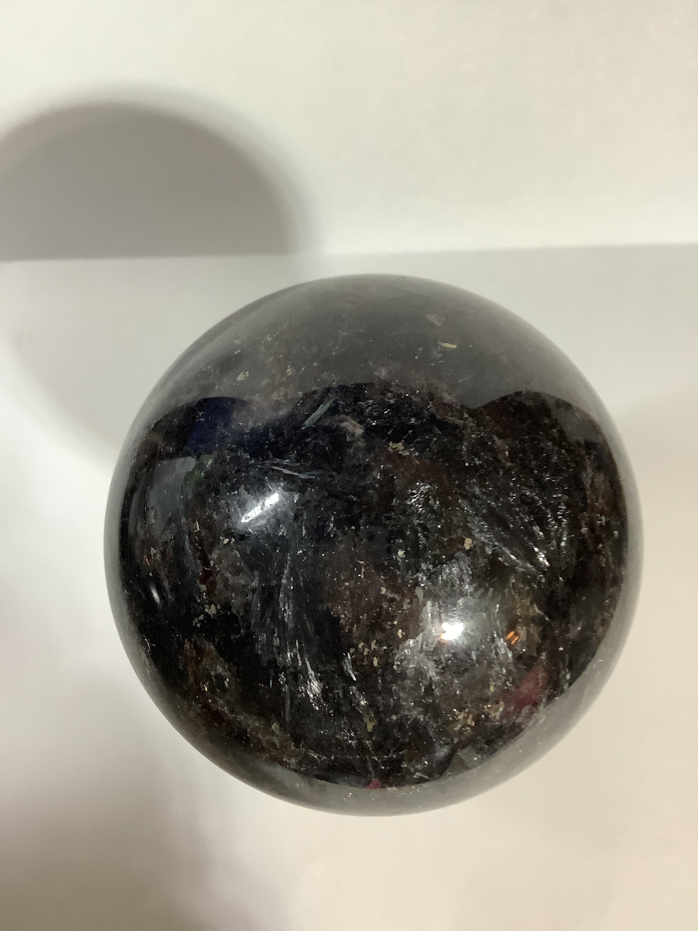 Astrophyllite and Garnet Sphere - Fireworks Stone with Blue and Silver Flashes