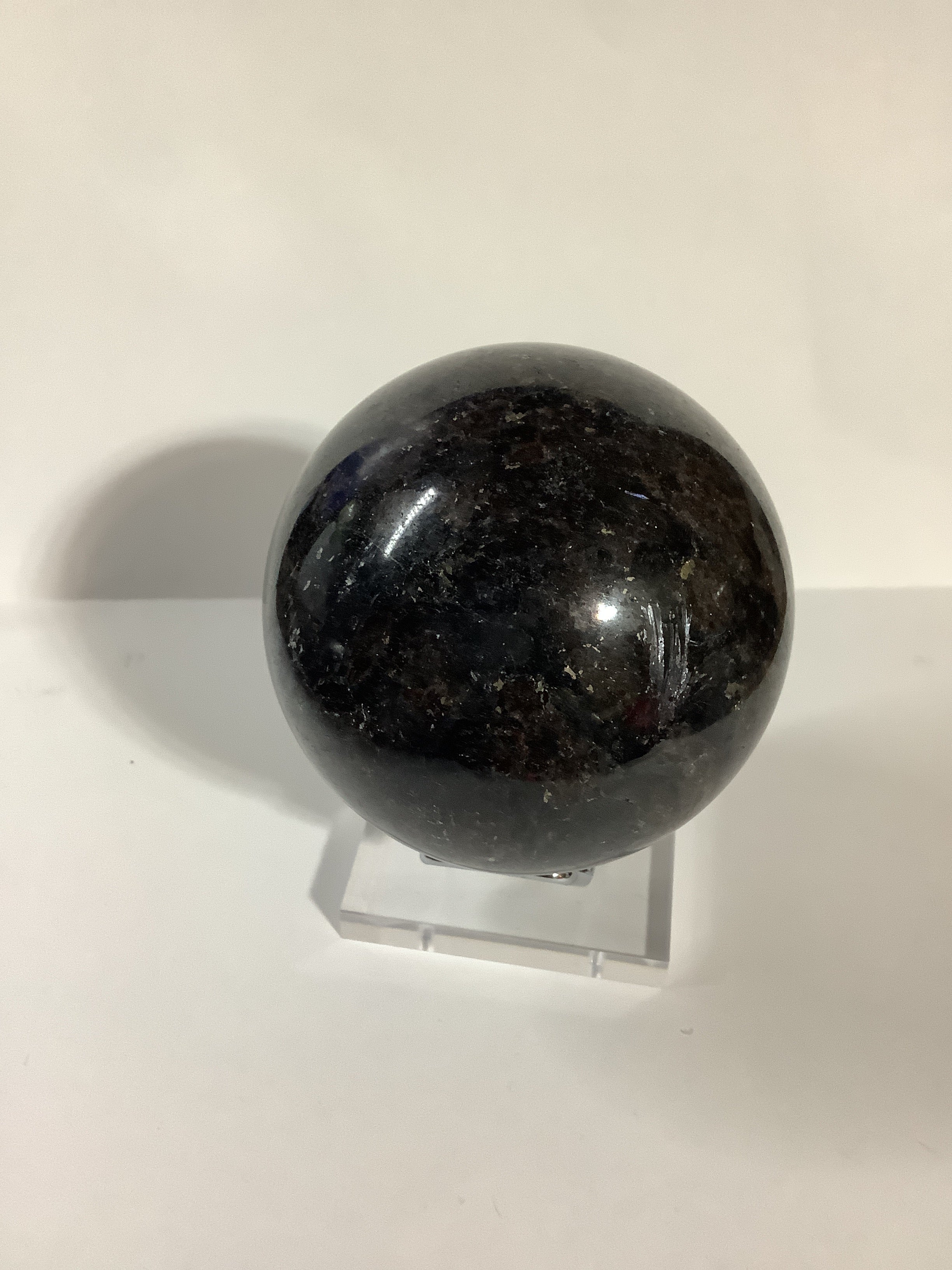 Astrophyllite and Garnet Sphere - Fireworks Stone with Blue and Silver Flashes