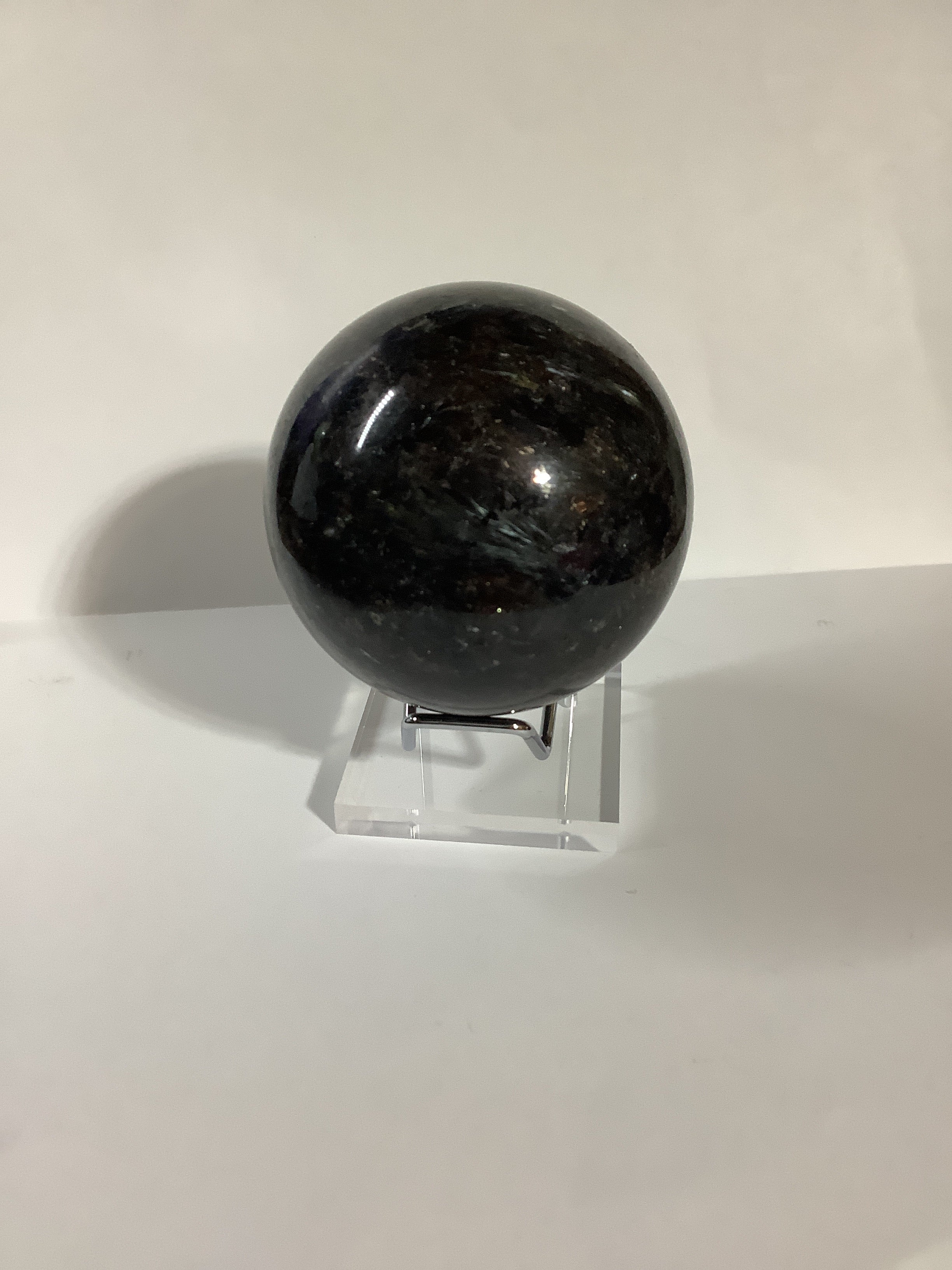 Astrophyllite and Garnet Sphere - Fireworks Stone with Blue and Silver Flashes