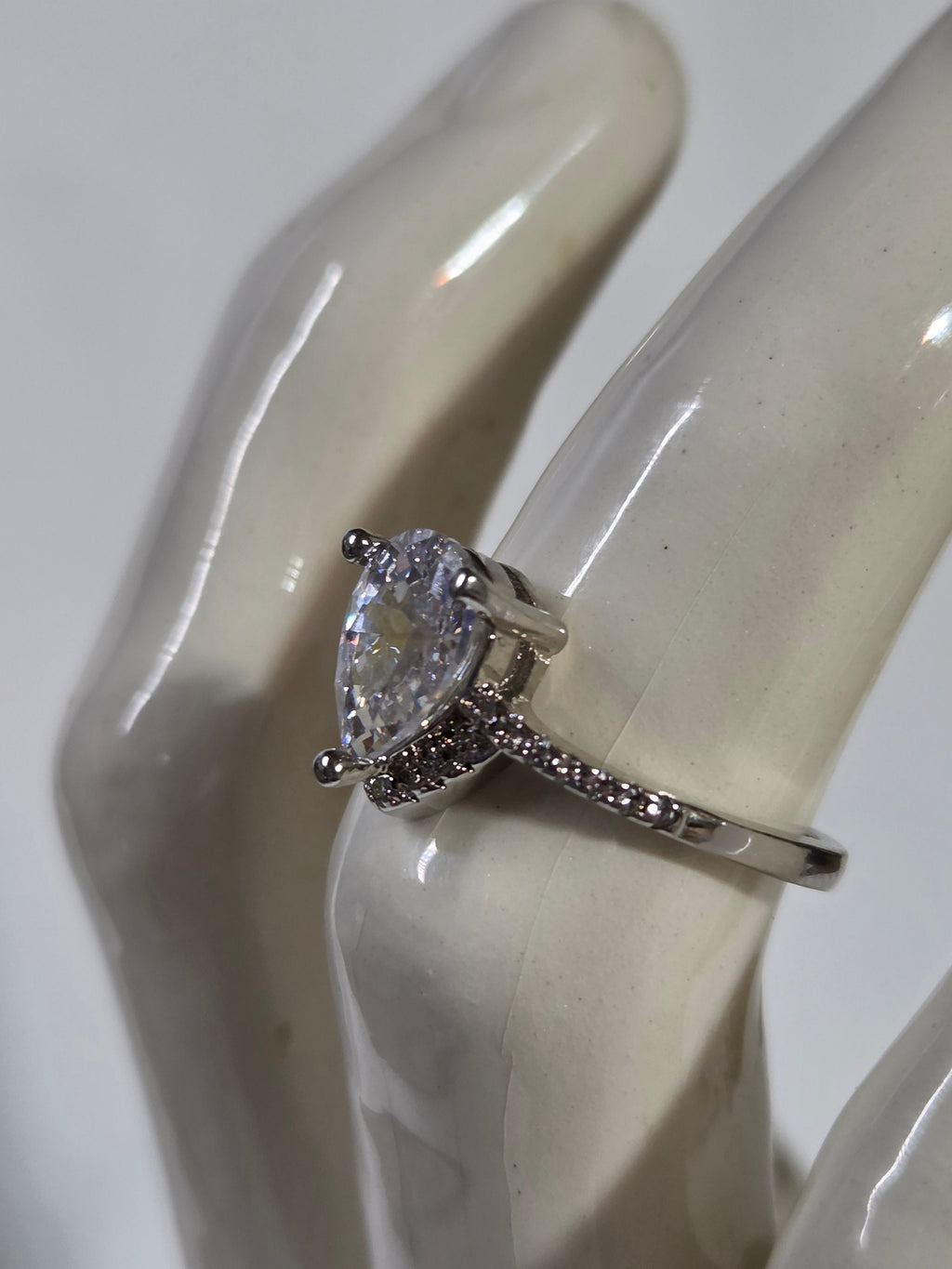 Clear Pear-Cut CZ Solitaire Halo Ring – Specimen 10 | Size 7 | Silver-Tone Costume Jewelry