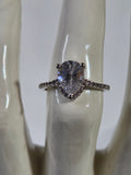 Clear Pear-Cut CZ Solitaire Halo Ring – Specimen 10 | Size 7 | Silver-Tone Costume Jewelry