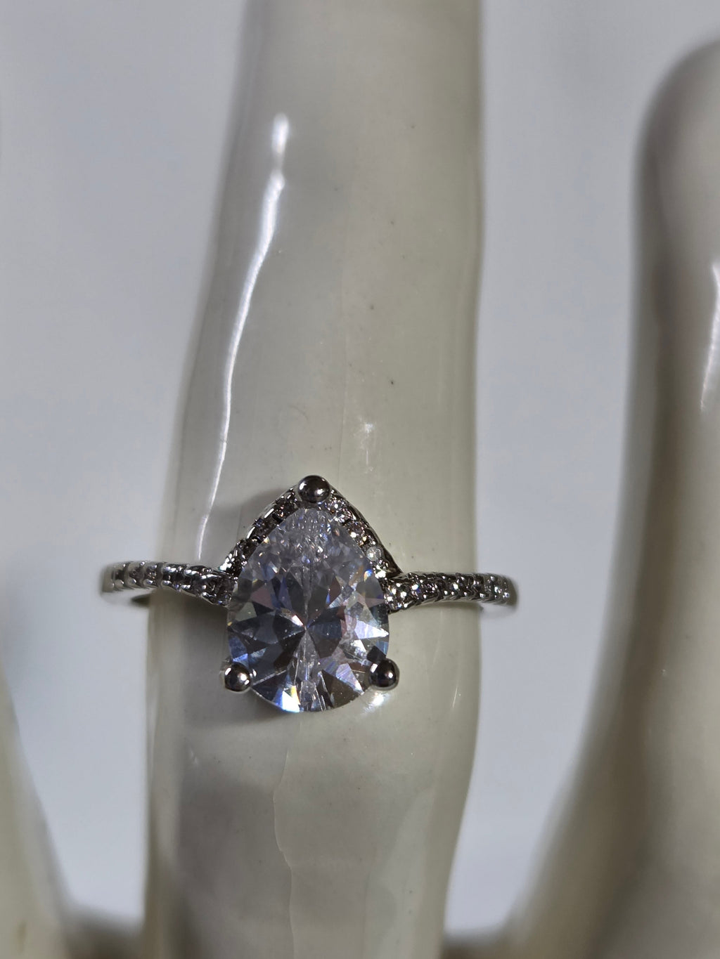 Clear Pear-Cut CZ Solitaire Halo Ring – Specimen 10 | Size 7 | Silver-Tone Costume Jewelry