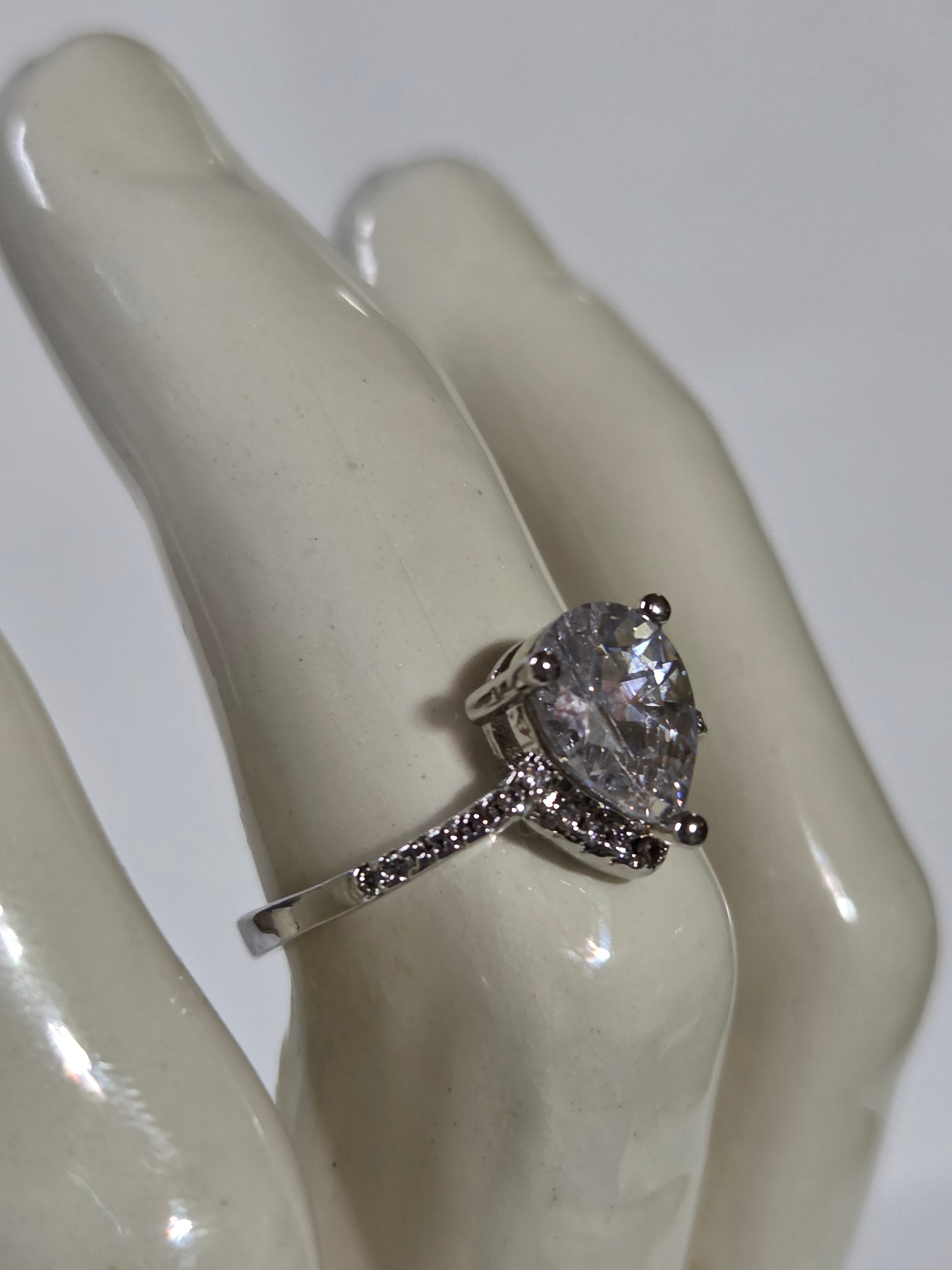 Clear Pear-Cut CZ Solitaire Halo Ring – Specimen 10 | Size 7 | Silver-Tone Costume Jewelry